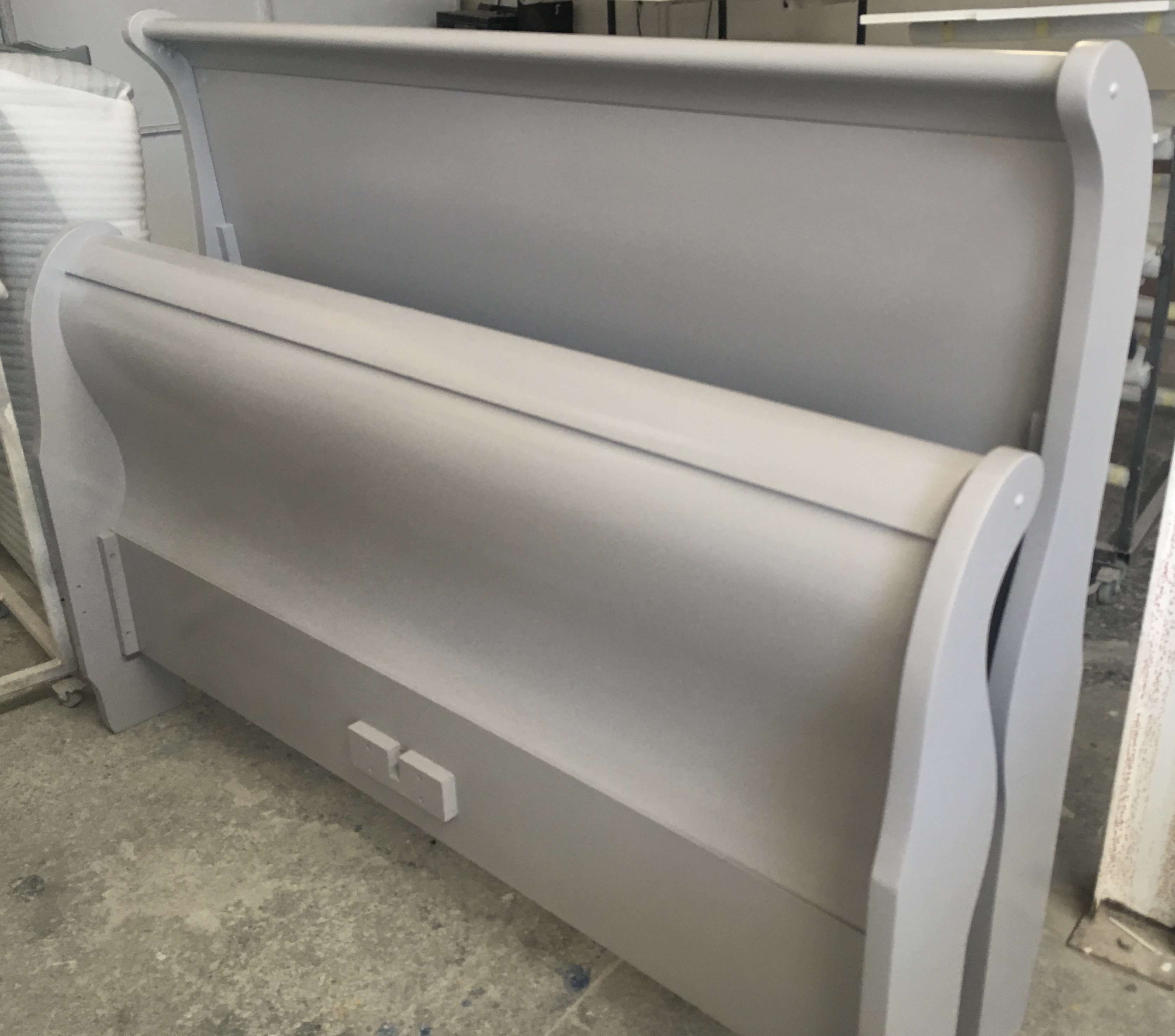 Sleigh bed goes from dark wood to grey